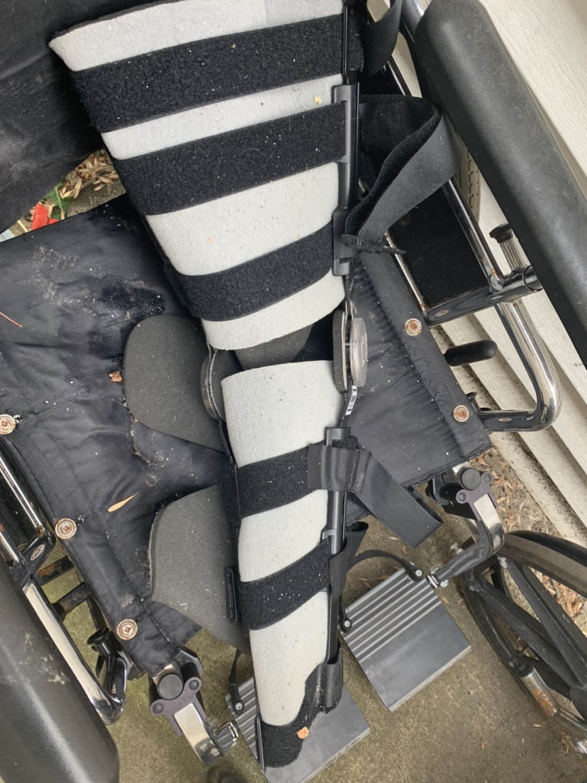 2 wheelchairs and leg brace