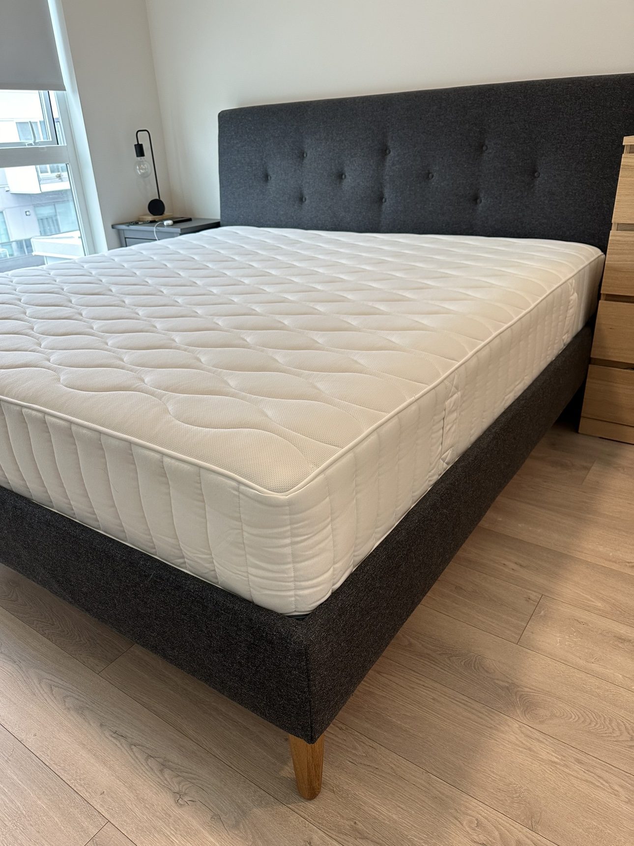 King bed with a firm hybrid mattress