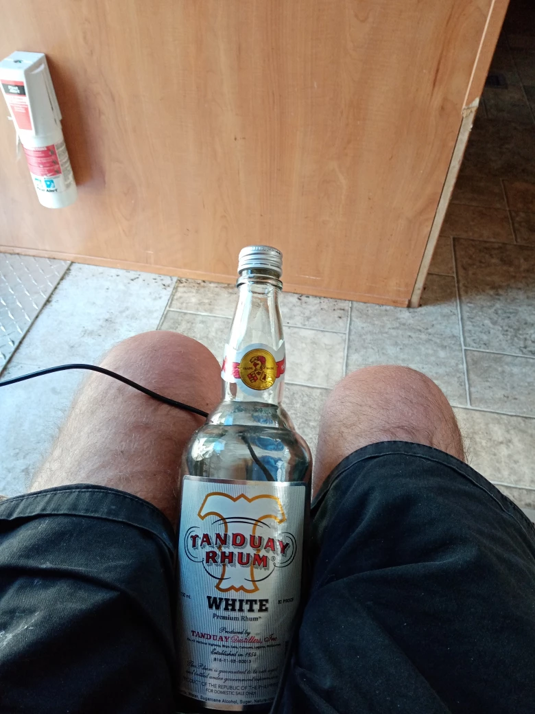 bottle of unsealed rum 15 cdn image indicator(2)