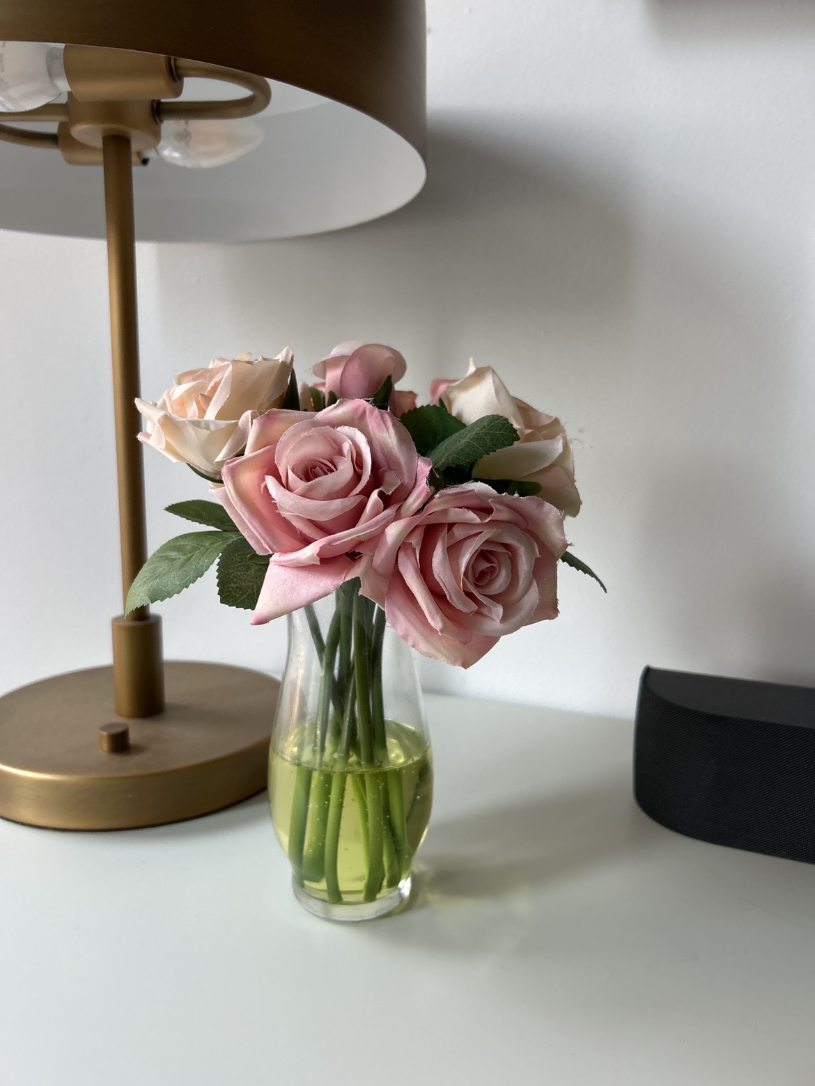 Artificial roses and vase
