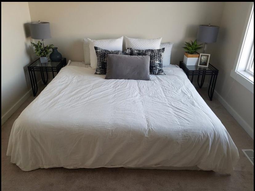 King size bed clean mattress & boxes. Delivery $