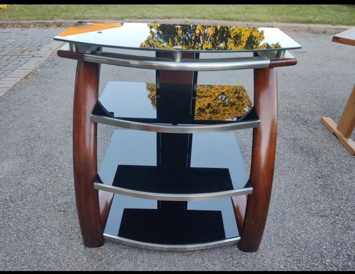 Black glass TV stand with walnut finish wood trim image indicator(2)