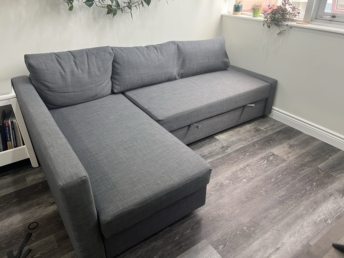 Sofa (pullout futon) with storage. Comes with futon mattress
