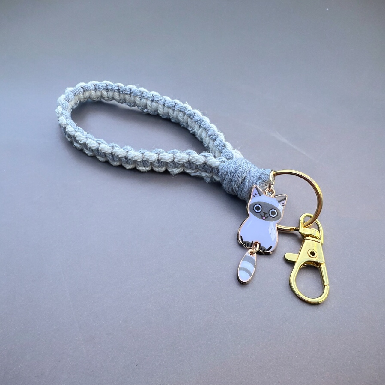 Handmade macrame keychain with a charm