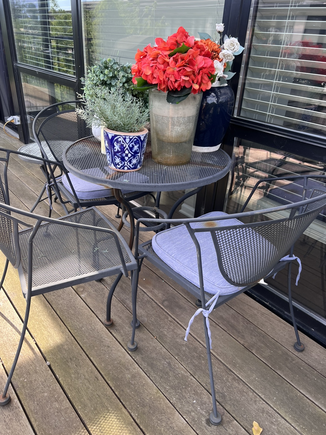 Outdoor bistro table and chairs and small table.