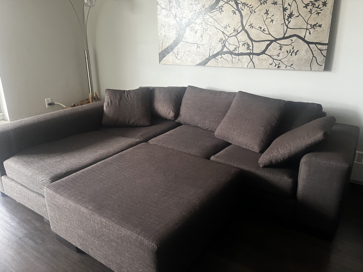 Large dark grey sectional with ottoman