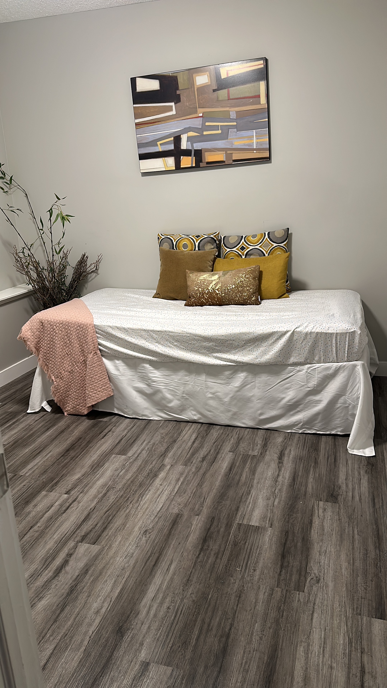 Twin bed with metal frame and mattress