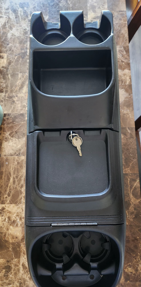 Van locking console cup holder