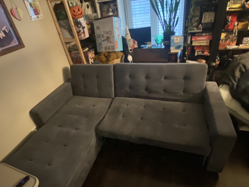 Sectional sofa with storage and pop out bed