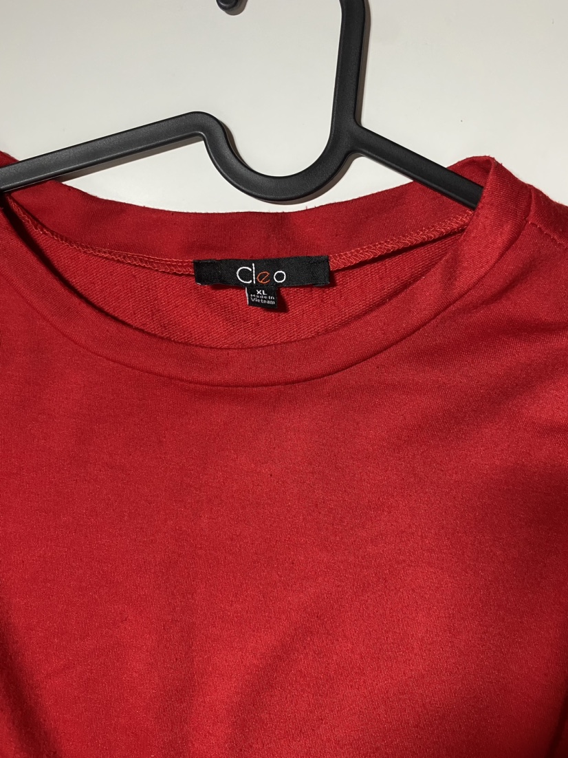 Red long sleeve shirt with white laces on sleeves image indicator(2)