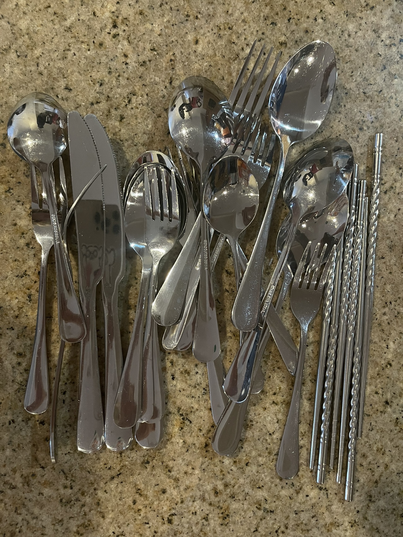Kitchen utencils: spoons, knives, forks, sticks