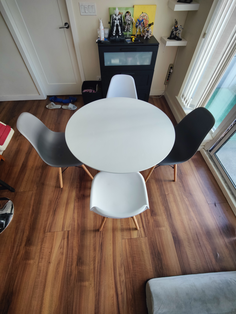 White round dining table set with 4 chairs