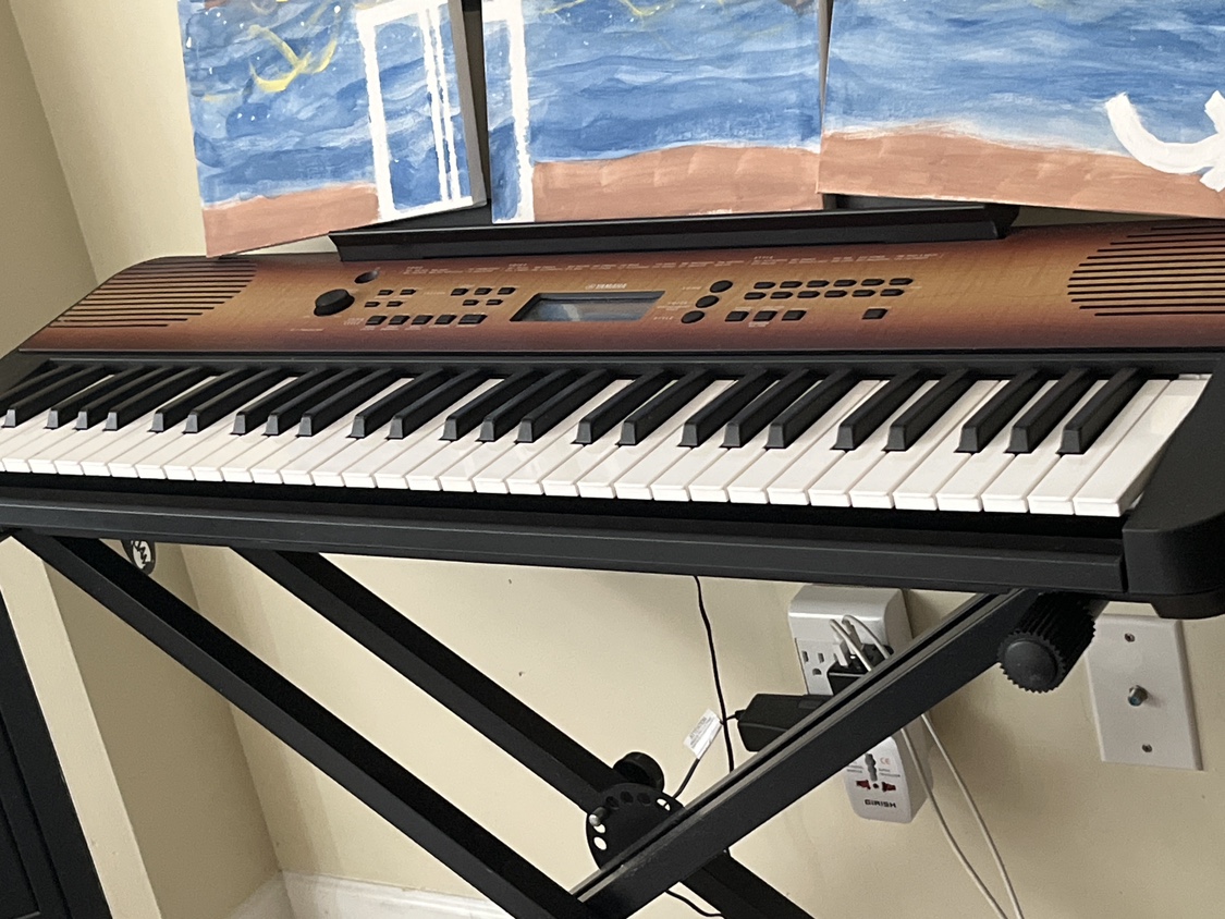 Yamaha piano with stand