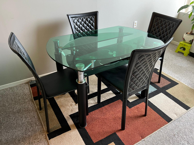 Glass Dining Table, 4 Chairs and the Rug.