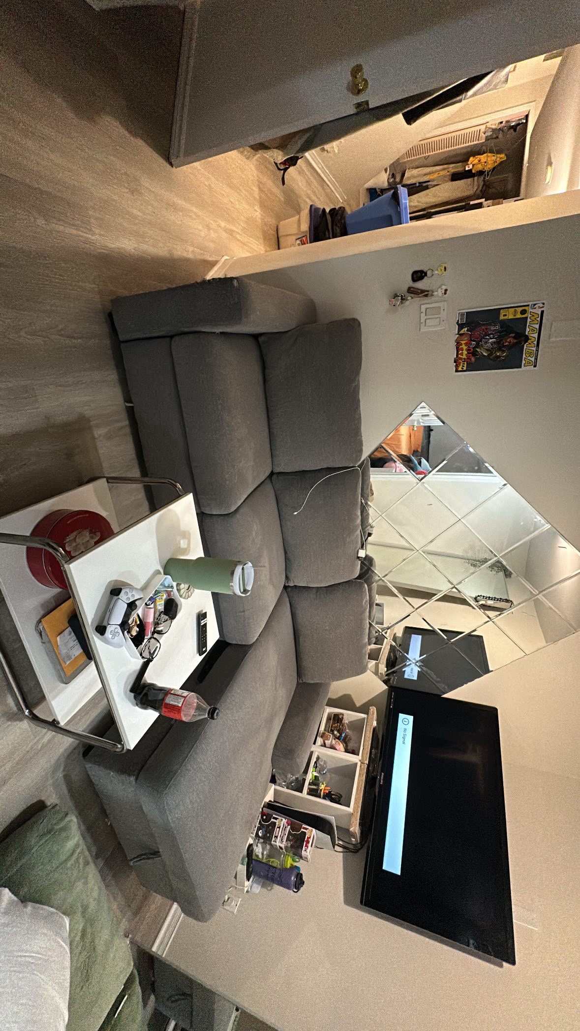 Grey L Couch with kick out foot rest
