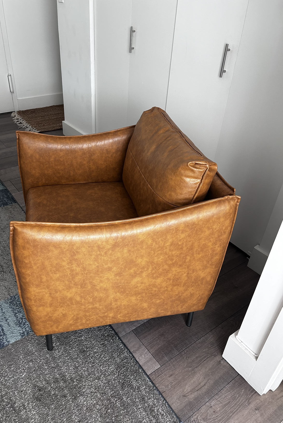 Armor Faux Leather Armchair with unique arms (
