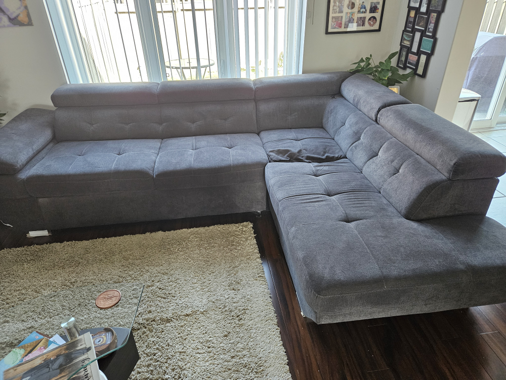 L Shaped sofa bed with built-in storage compartments
