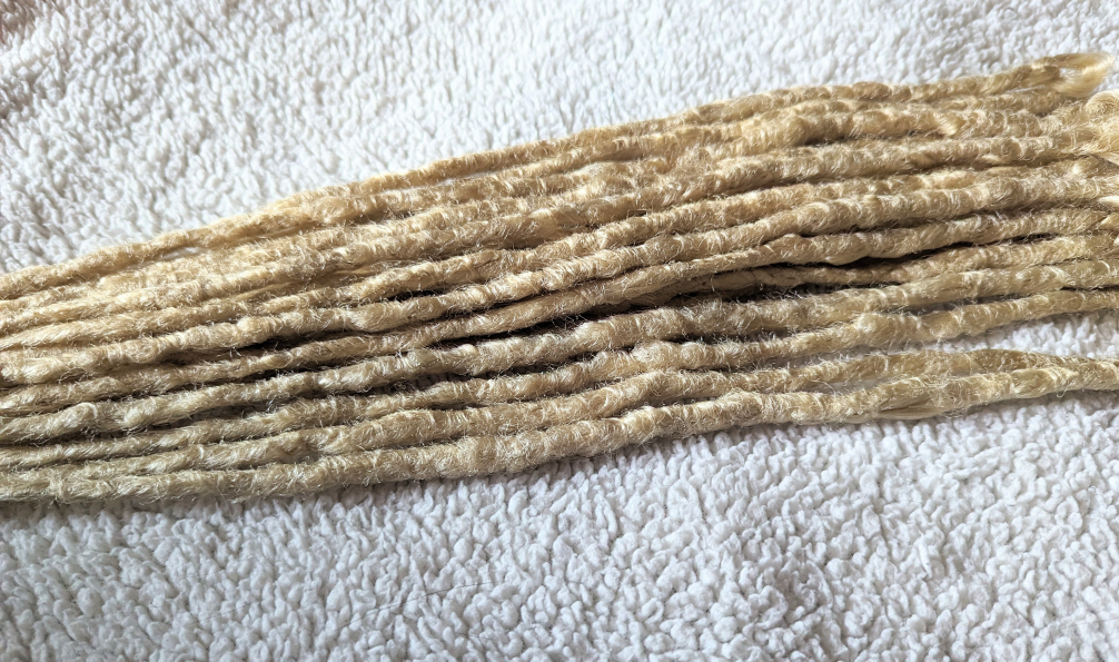 New partial set of blonde crochet synthetic dreads image indicator(2)