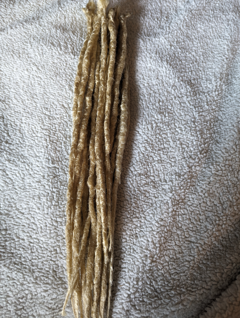 New partial set of blonde crochet synthetic dreads image indicator(3)