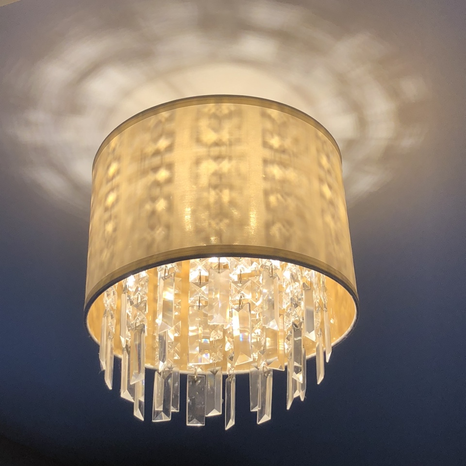 Crystal chandelier with linen shade