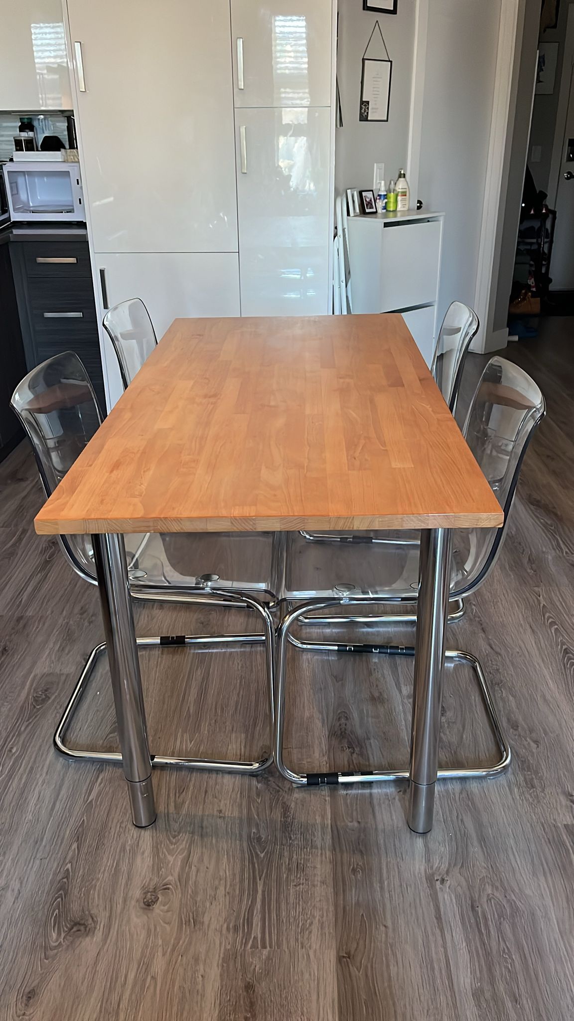 Solid wood table with adjustable legs