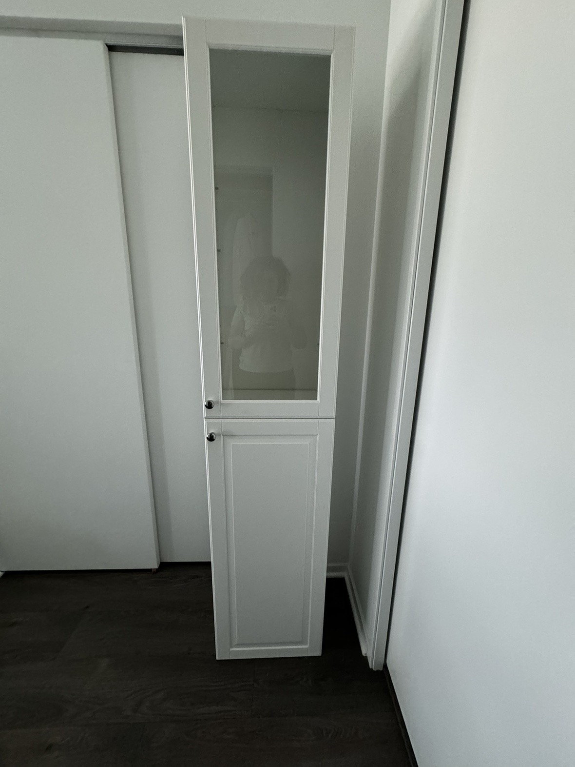 White cabinet with glass door