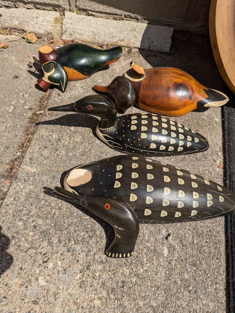 Hand crafted wooden ducks and loons