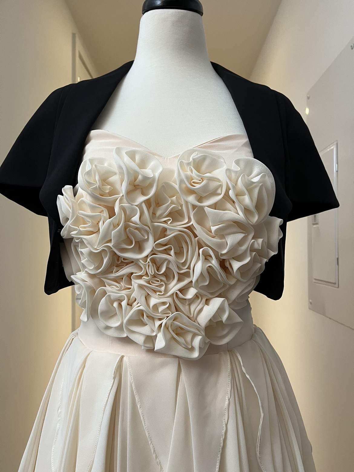 Rose party dress with black bolero and a black bag image indicator(3)