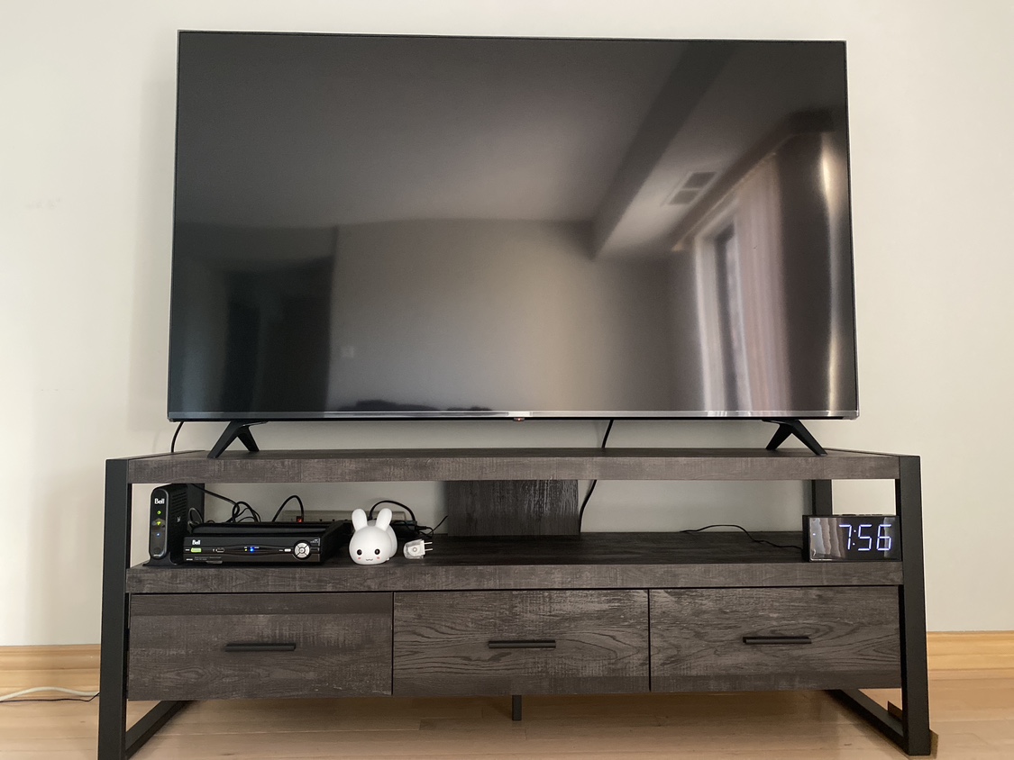 65" LG TV and table