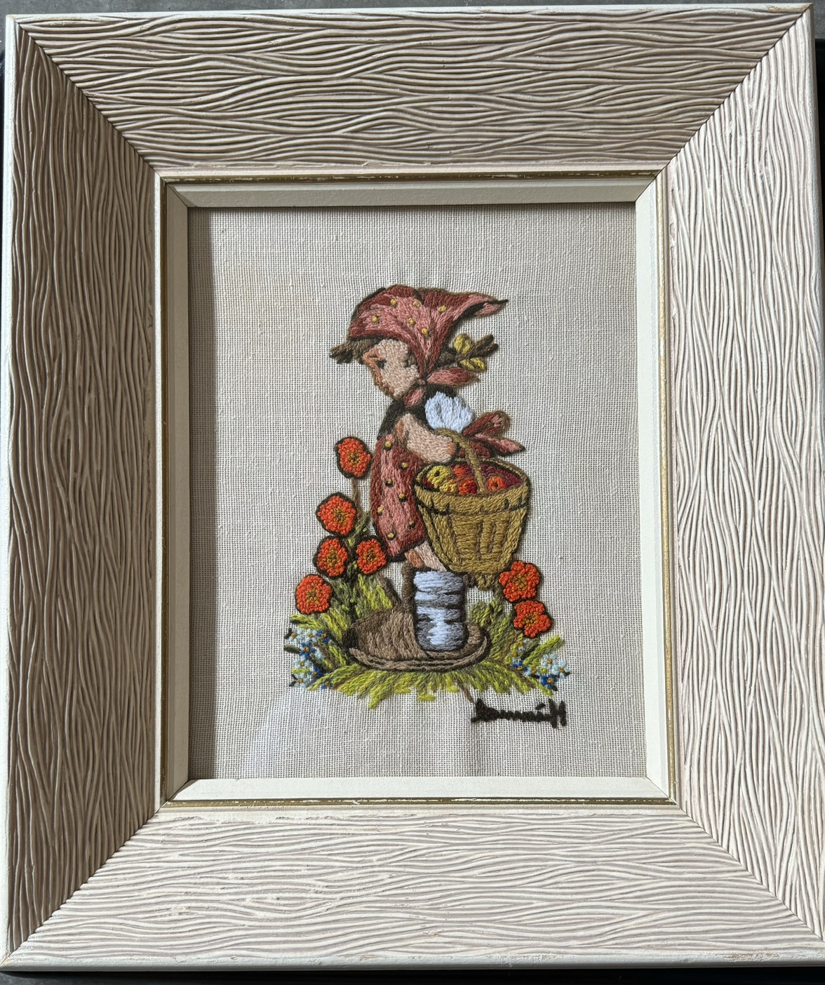 Hummel stitched picture in heavy vintage beige wood frame.