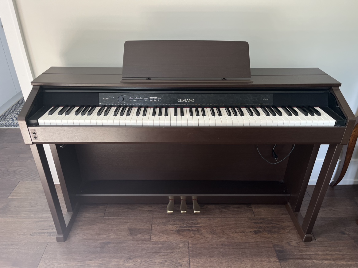 Casio Celviano Piano + Piano Books