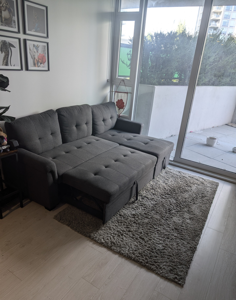 New Dark gray sofa bed pull-out and storage.