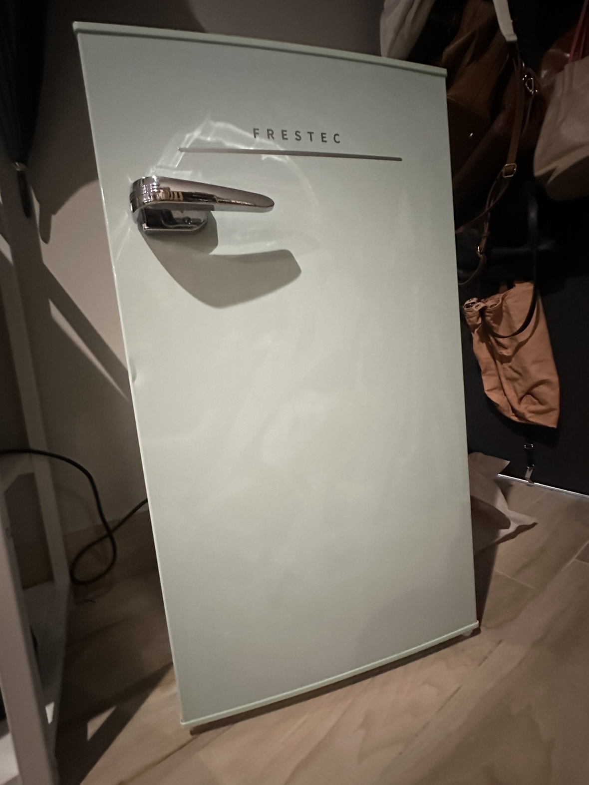 Mint green mini fridge