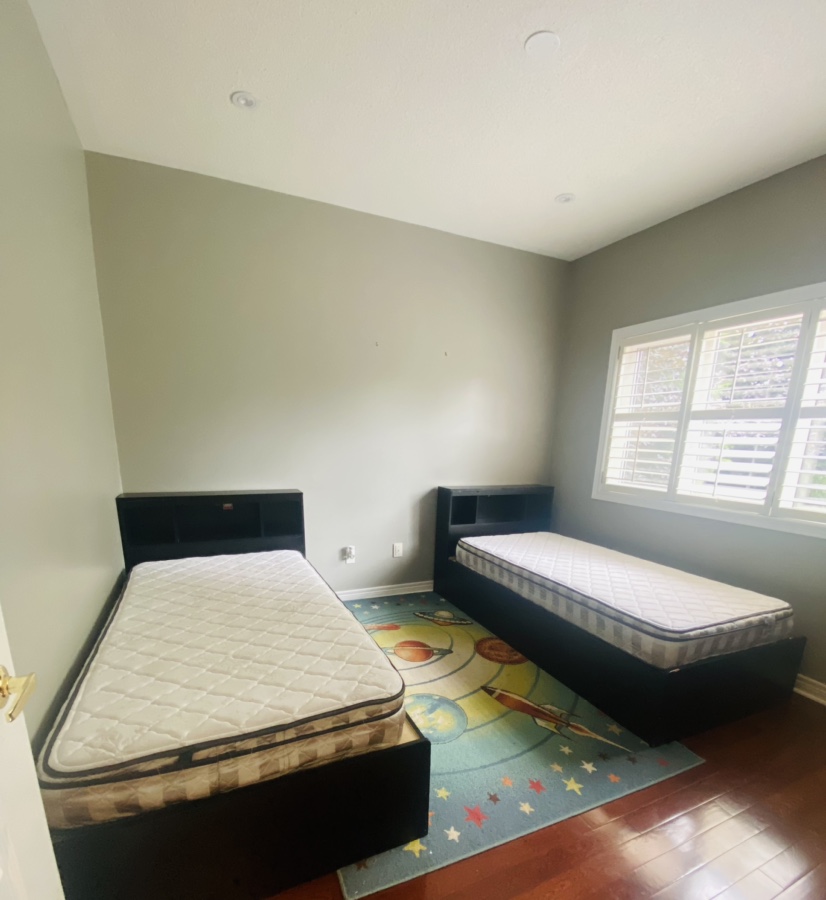 Kids twin size bed with mattress and rug