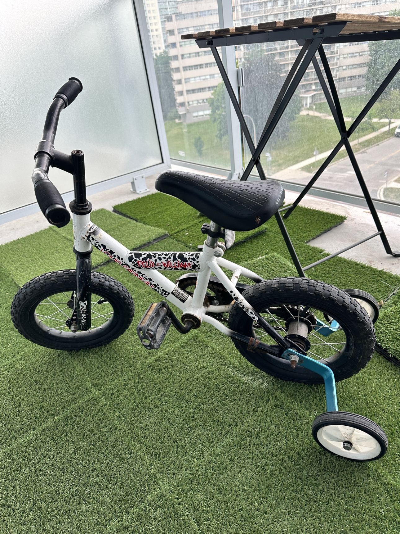 Kid’s bicycle with training wheels