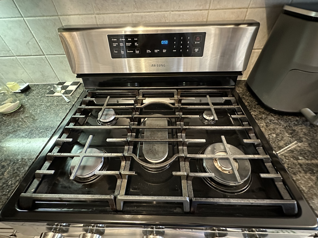 Samsung 6.0 cu. ft. Gas Range and hood fan - photo 2
