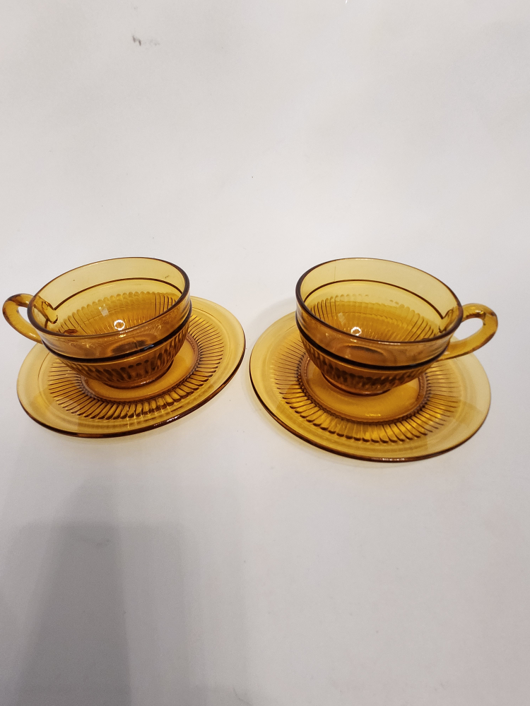 2 Mid Century Amber Glass cup and saucer sets