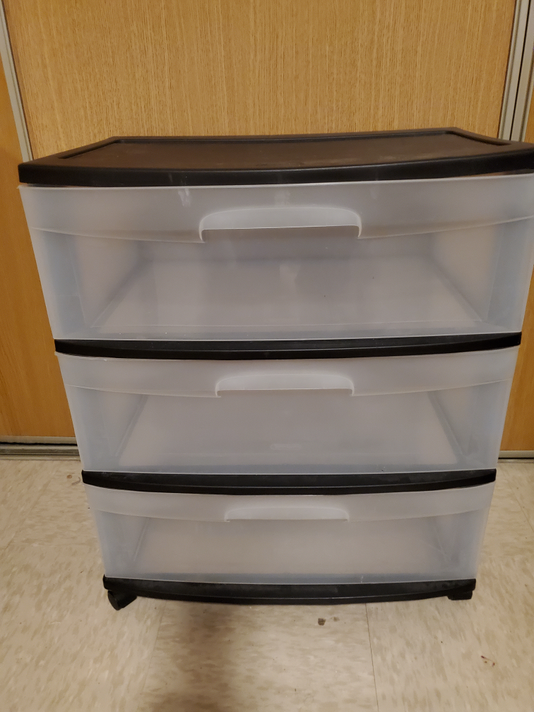 Storage container with 4 wheels .