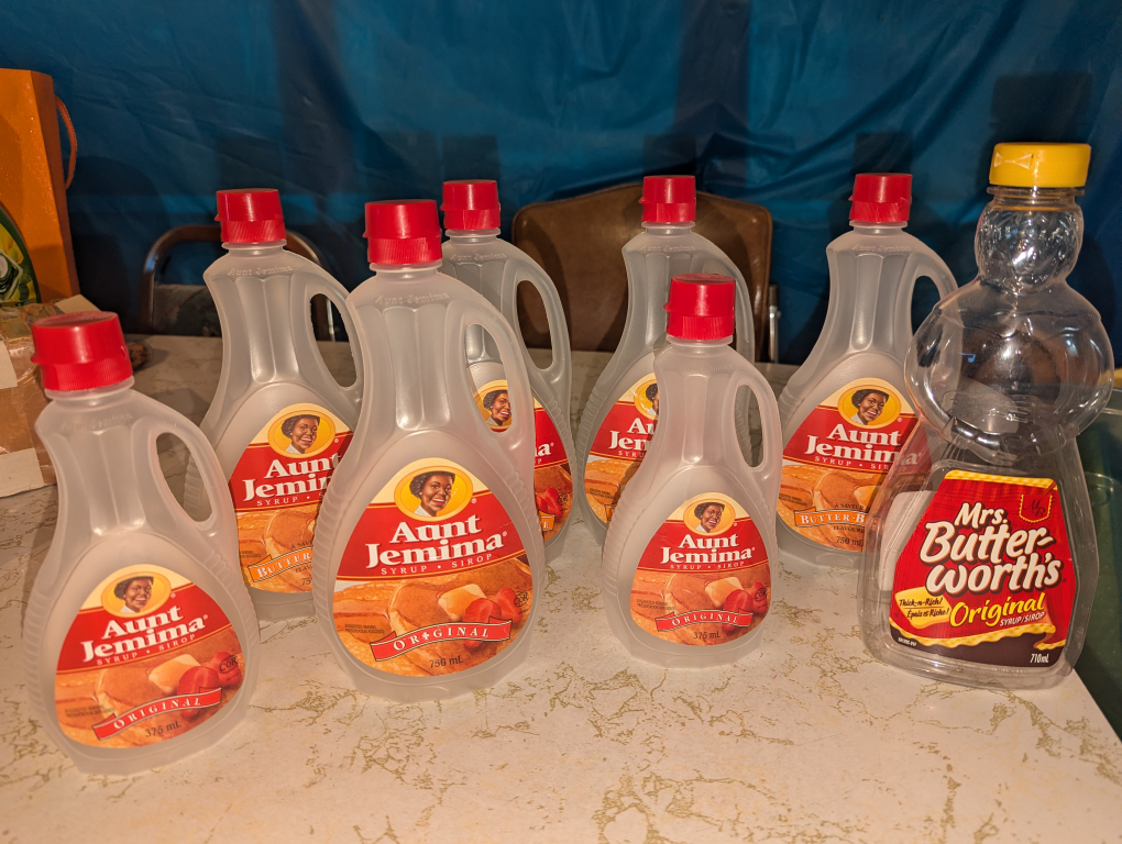 Aunt Jemima bottle and a Mrs. Butterworth bottle collectables image indicator(3)