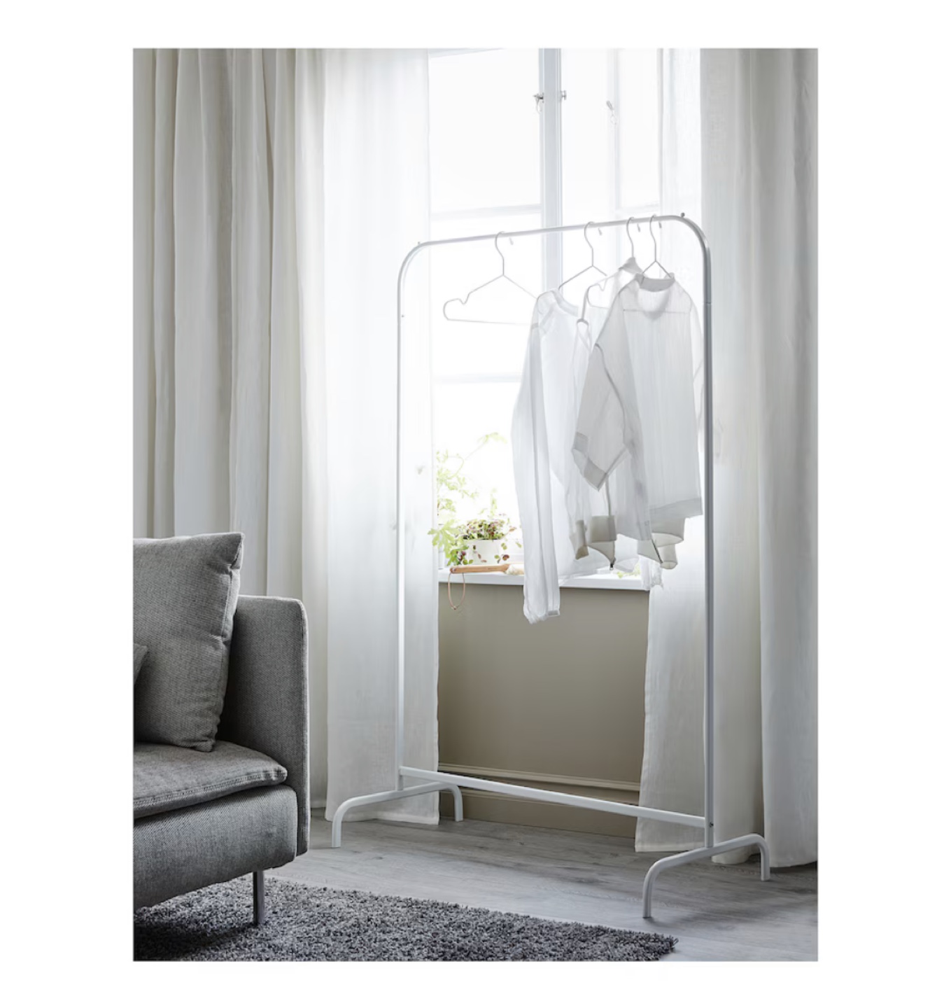 Ikea clothes rack with 8 white hangers - photo 2
