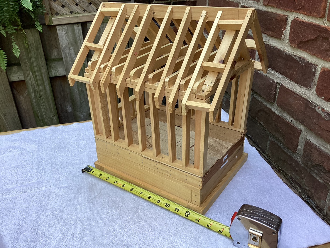 Model unfinished wood construction of a house ! image indicator(6)