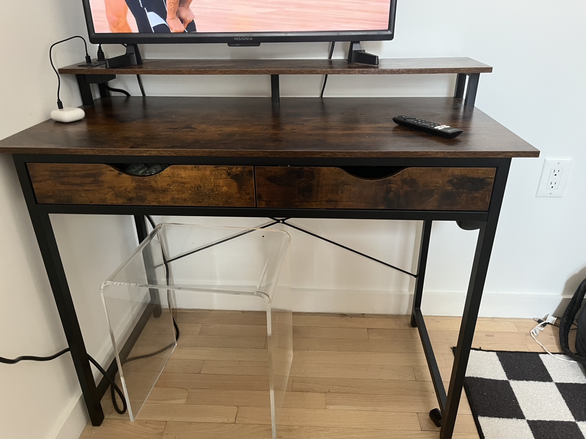 Desk with monitor stand and outlits