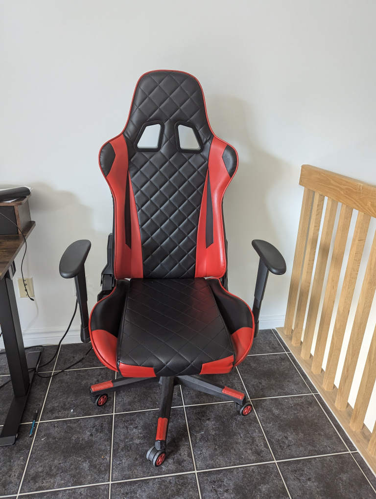 High Quality Gaming Chair, adjustable height & seating angle.