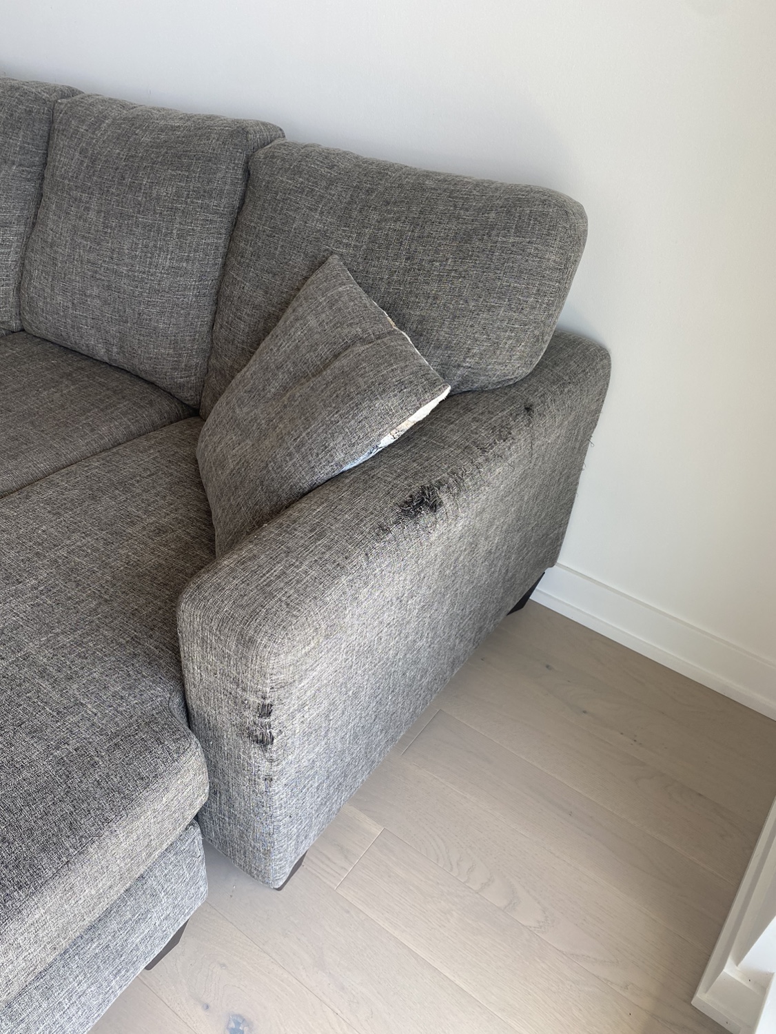 3-person L-shaped grey couch with matching cushions - photo 3