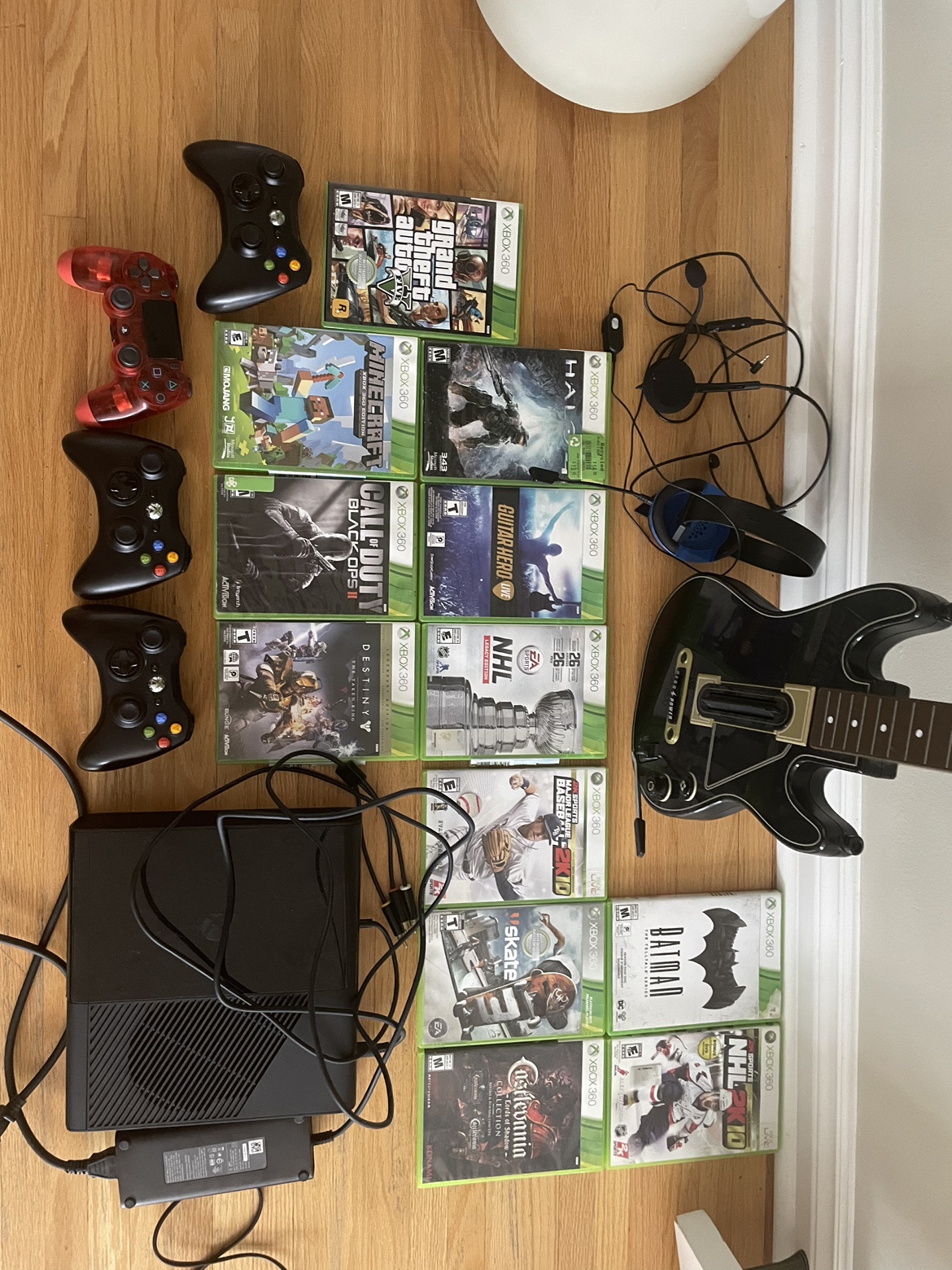 Xbox 360 console, 4 handhelds, guitar and 12 games