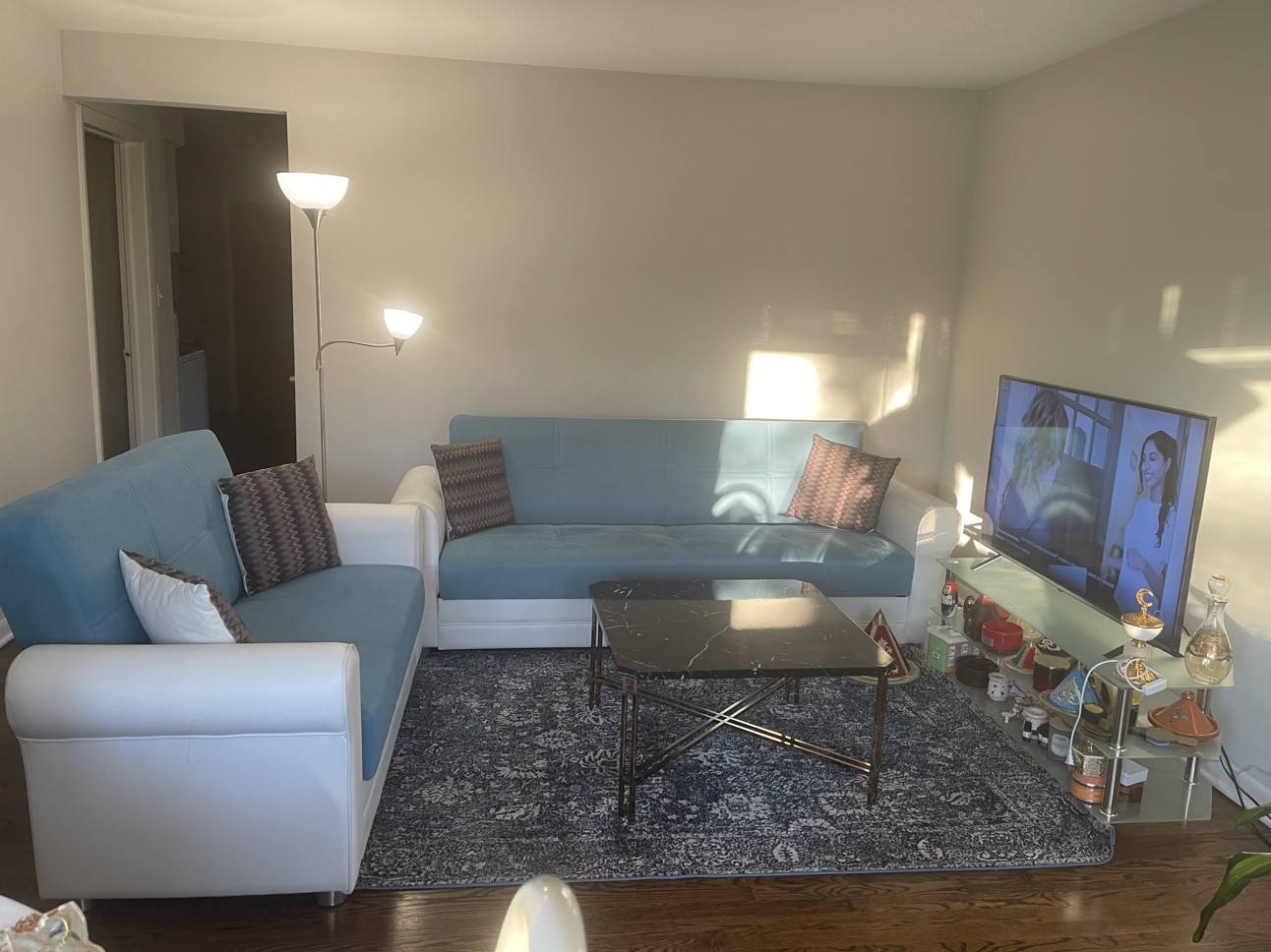 2 blue and white couches