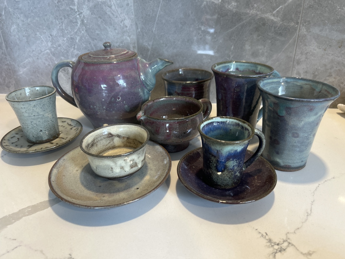 stoneware tea set and assorted cups