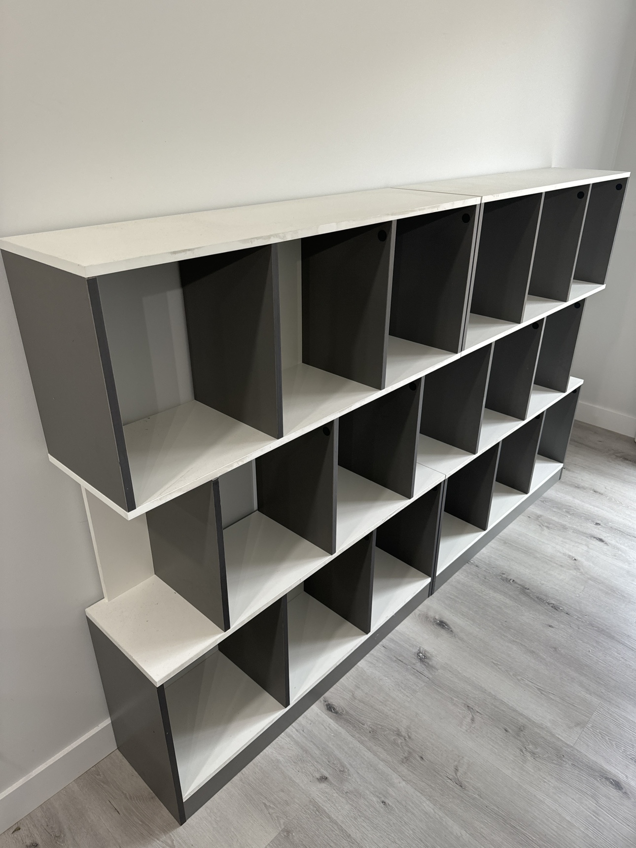 Two gray and white shelves