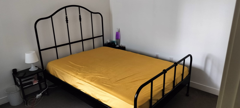 double bed frame with mattress and side tables thumbnail