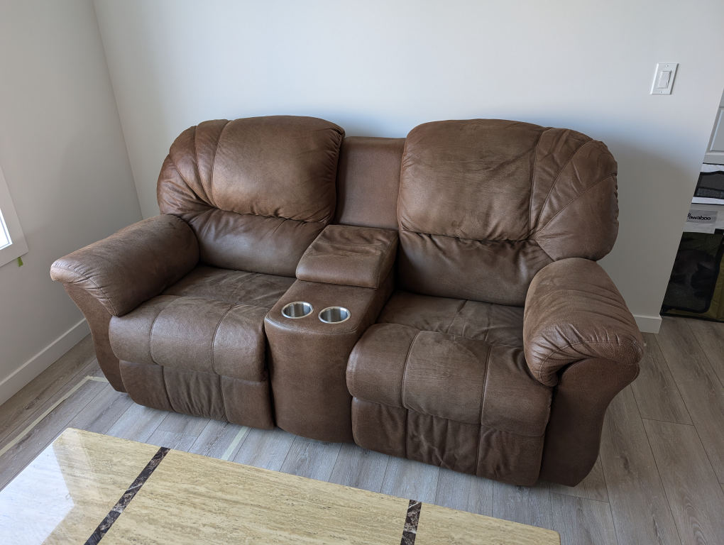 Reclining loveseat with console